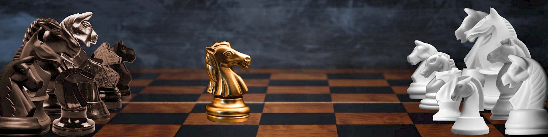 Chessboard with black and white horses, a golden horse in the centre.