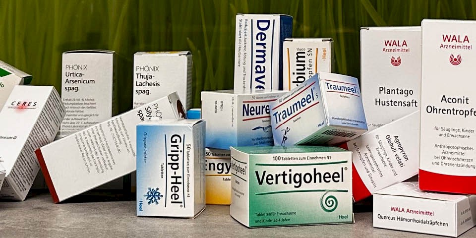 Various homeopathy-related products on one table