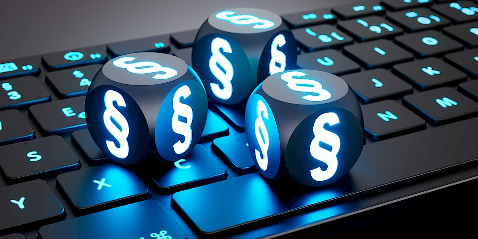 Image of cubes depicting paragraph signs, lying on a keyboard.